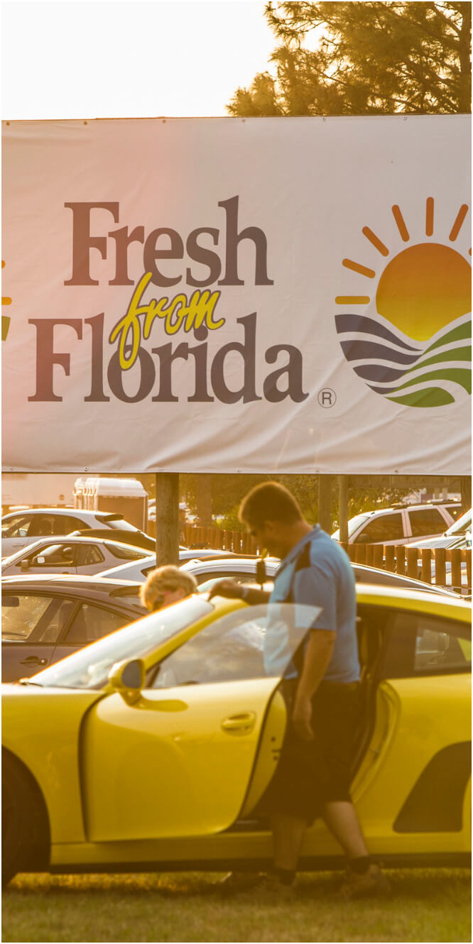 Man entering yellow car
